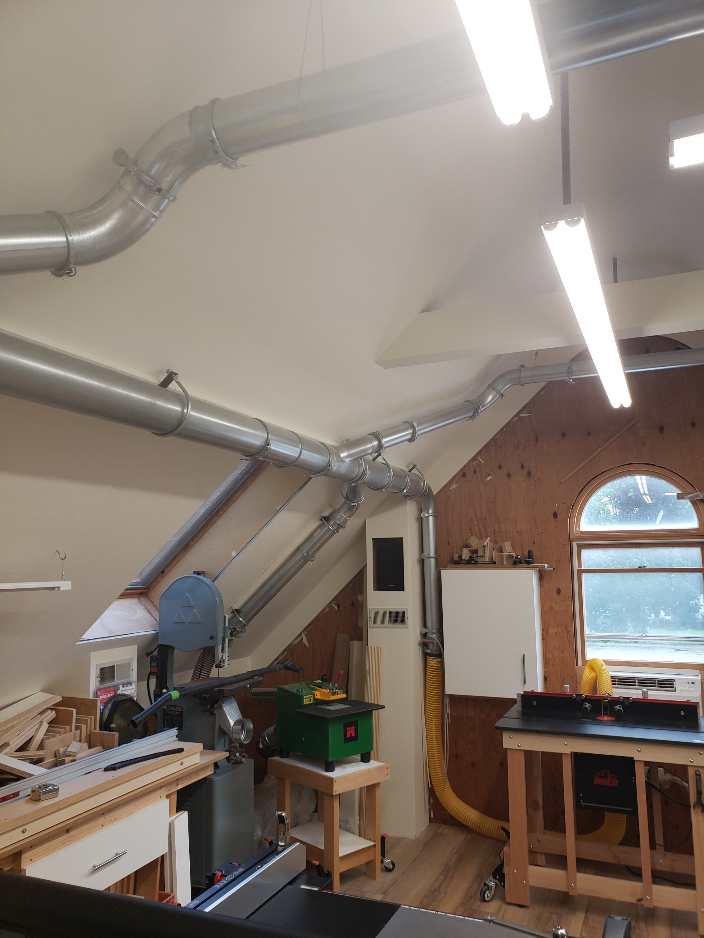 Fully assembled Nordfab slip-fit duct run with clamps securing branch and adapter fittings.