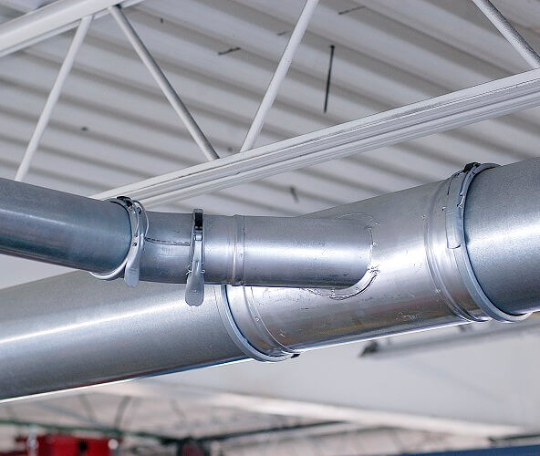 Installed exhaust ducting used to remove vehicle exhaust fumes at the source.