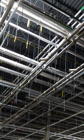 Ductwork with Quick-Fit clamp connections installed for industrial dust collection.