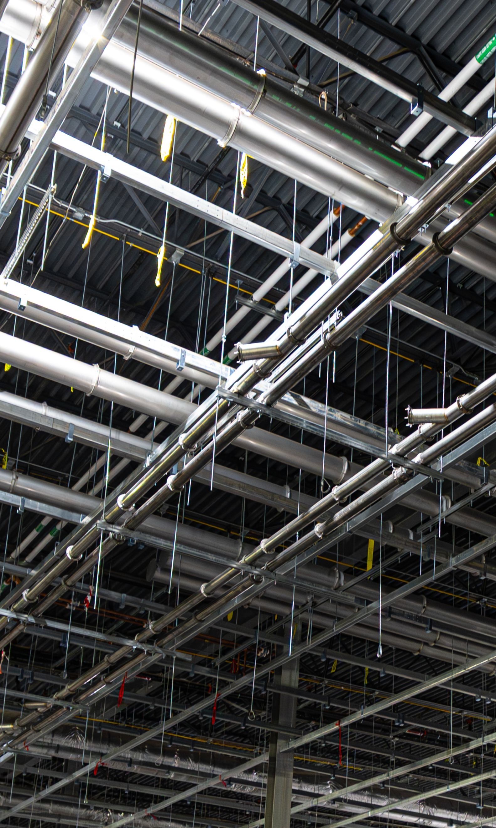 Ductwork installed with Nordfab Quick-Fit clamp connections in an industrial facility.